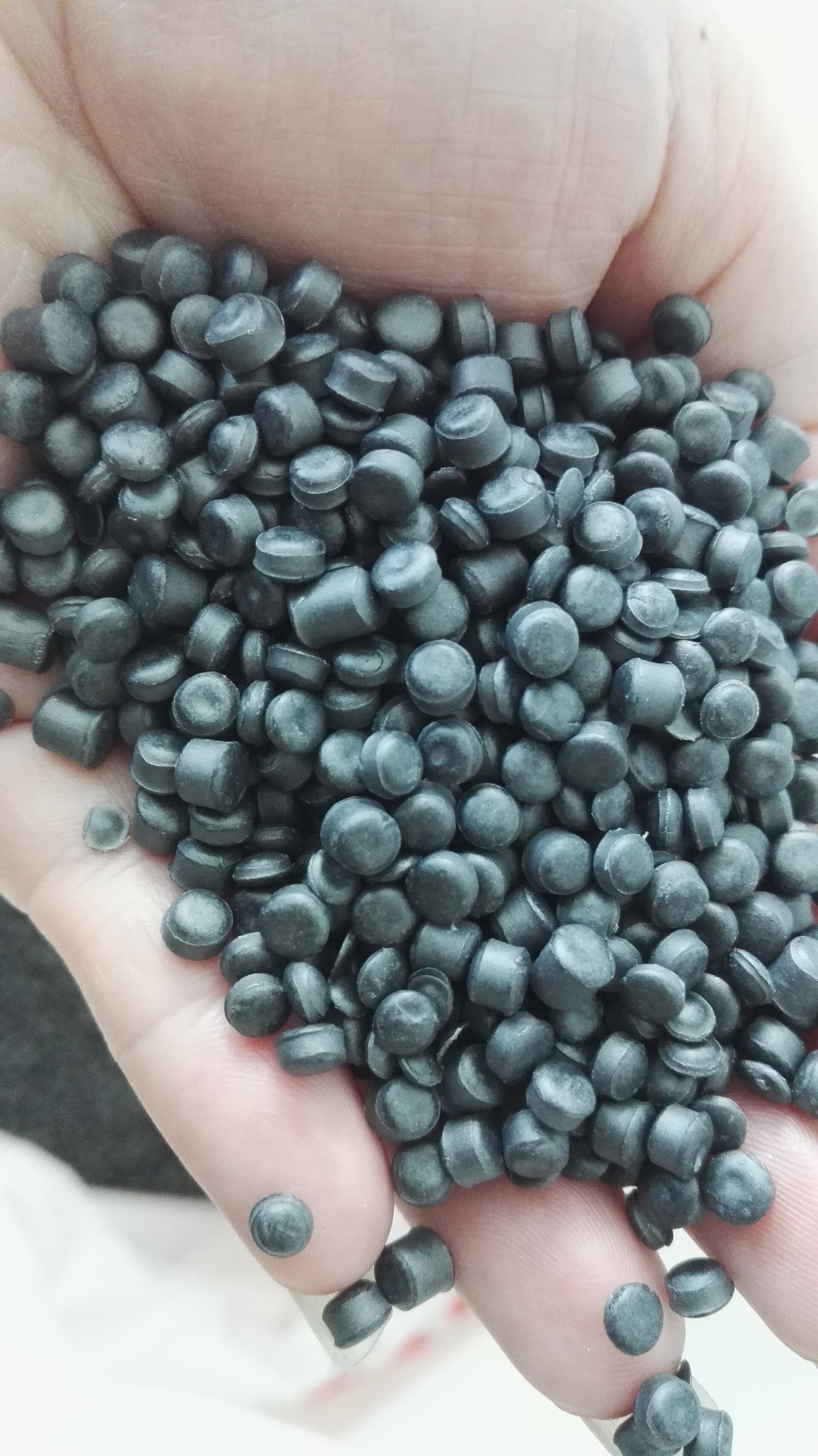 Real plastic pellets photo from Wikimedia Commons for injection molding material selection
